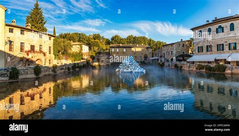 Thermal bath town of Bagno Vignoni, Italy during sunrise. Old thermal ...