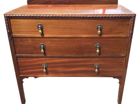 Sold Price An Edwardian Mahogany Chest With Three Graduated Long Drawers Mounted With Brass