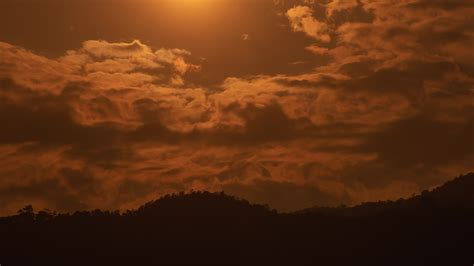 Sunset Over A Mountain In The Orange Sky 4k Time Lapse Video 17554108