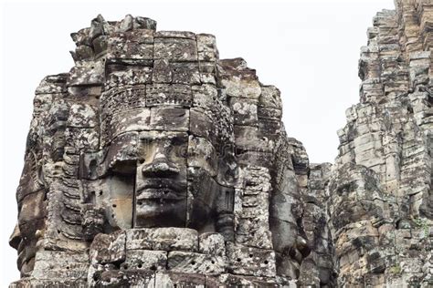 Stone Face Tower Of Ancient Buddhist Temple Bayon In Angkor Wat Complex