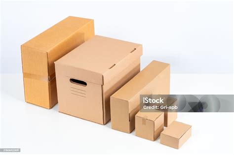 Carton Boxes Unlabeled Boxes On A White Background Concept Sale Of Corton Containers Packaging