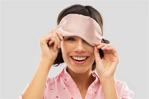 Premium Photo Happy Young Woman Peeking From Under Sleeping Mask