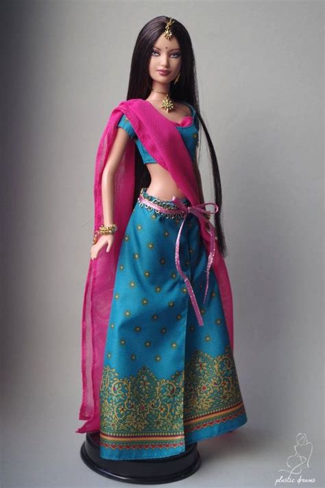 A Barbie Doll Wearing A Blue And Pink Outfit