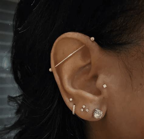 How To Treat Infected Ear Piercings According To Derms