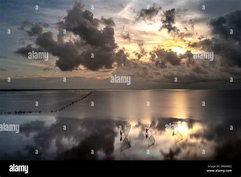 The Image Of Fishermen In The Fishing Village Using Homemade Tools To