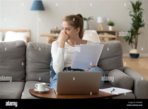 Thoughtful Young Female Distracted From Studying Looking Away Stock