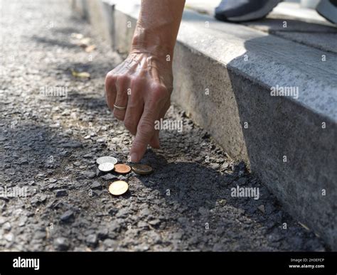 Finding Money On The Street Gbp Coins Stock Photo Alamy