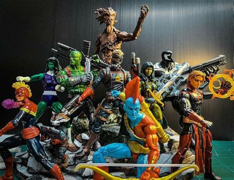 a group of action figures sitting on top of a table