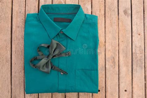 Green Shirt and Green Bow Tie Stock Photo - Image of folded, background ...