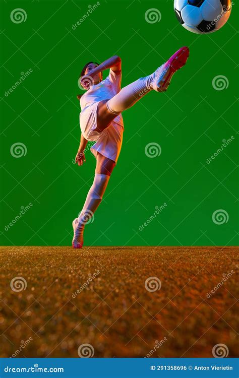 Bottom View Dynamic Image Of Young Woman Football Player In Motion