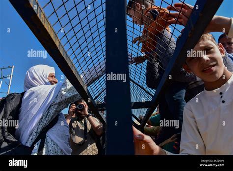 A Kashmiri Muslim Pilgrim L Is Embraced By Her Relatives Before