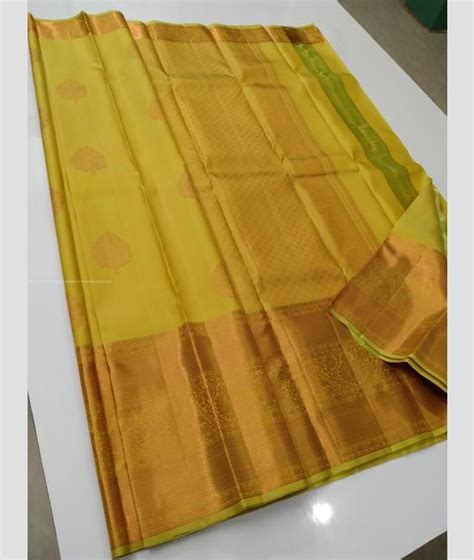 Yellow And Golden Color Kanchi Pattu Sarees With Double Border Design