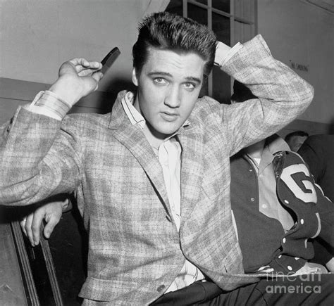 Elvis Presley Combing His Hair By Bettmann