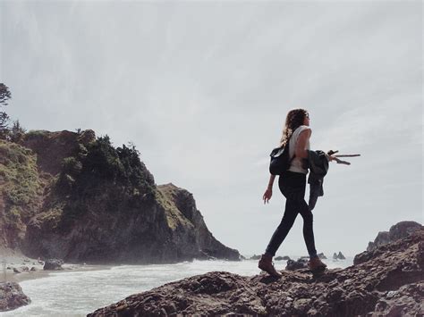 Woman Walking On Coast Cliff By Stocksy Contributor Kevin Russ