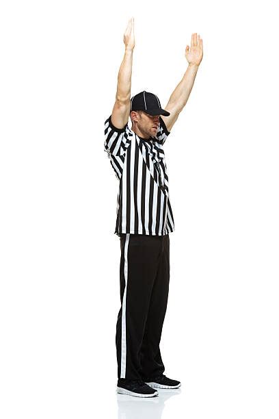 Royalty Free Silhouette Of Football Referee Signaling Touchdown