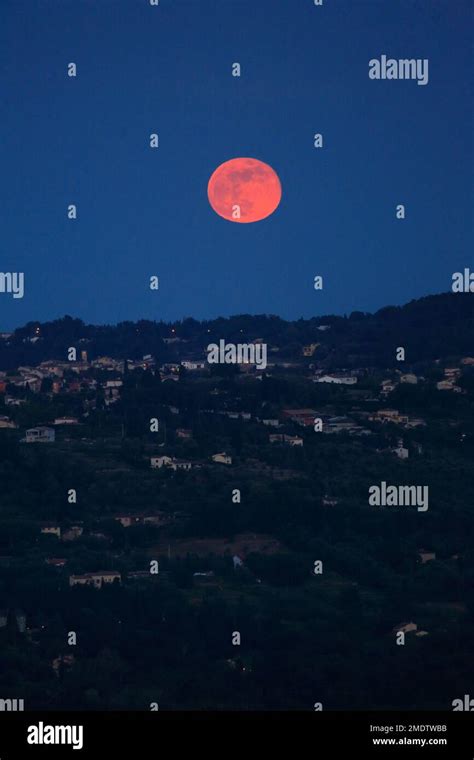 Red Full Moon Above The Village Of Plascassier Alpes Maritimes French