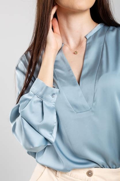 Premium Photo Elegant Woman In A Blue Blouse With A Plunging Neckline