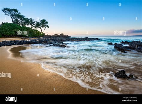 Sunrise Over Beautiful And Secluded Secret Beach In Maui Hawaii Stock