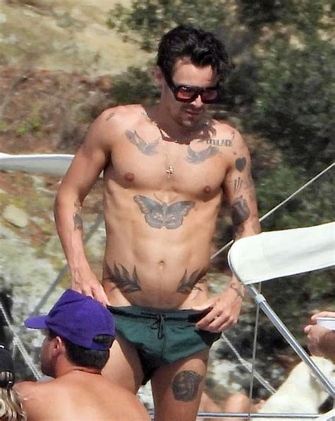 Harry Styles Flashes Tattoo Believed To Be Devoted To Ex Olivia Wilde While On A Boat Trip With