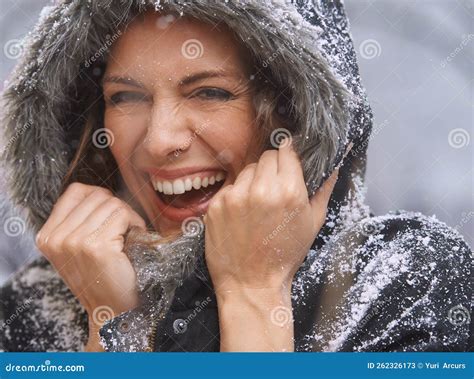 Loving The First Snowfall An Attractive Woman Enjoying Herself Outside