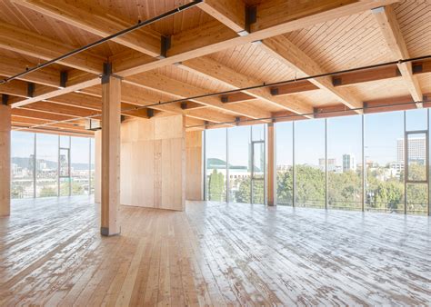 Glass Facade Reveals Timber Structure Of Portland Office Building