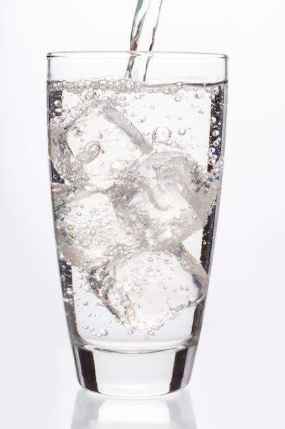 Premium Photo Close Up On Sparkling Water Filling A Glass