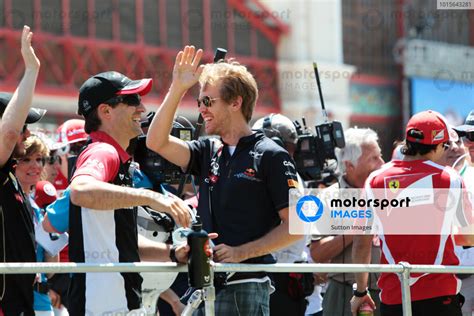 Sebastian Vettel GER Red Bull Racing And Timo Glock GER Virgin