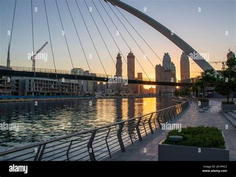 Dubai, UAE - 01.08.2021 Bridge over a Dubai Water canal known as ...