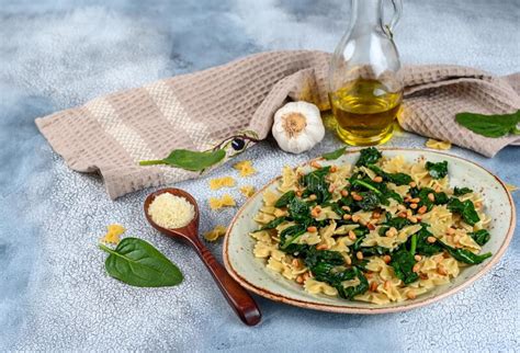 Vegan Farfalle Pasta In A Basil Spinach Sauce With Garlic And Parmesan Stock Image Image Of