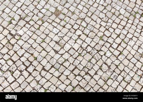 Abstract Background Of Old Cobblestone Pavement Close Up Stock Photo