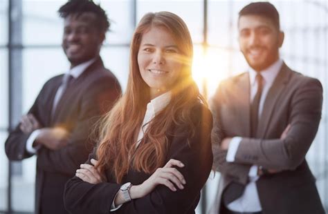 Premium Photo Happy Cheerful Business People Posing In Office Hallway