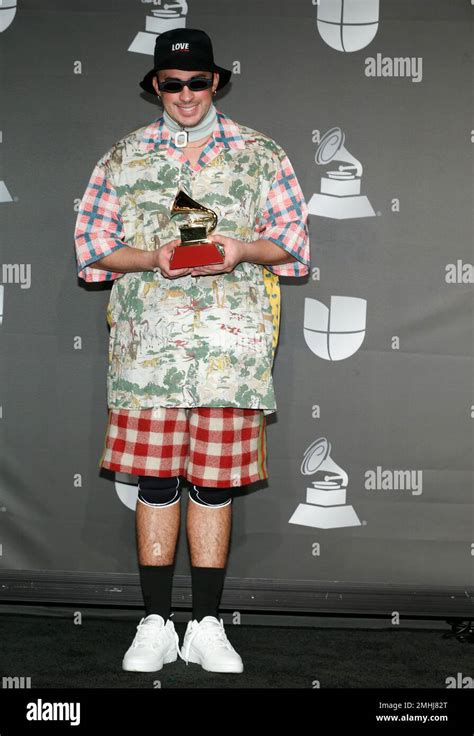 Bad Bunny Poses In The Press Room With The Award For Best Urban Music