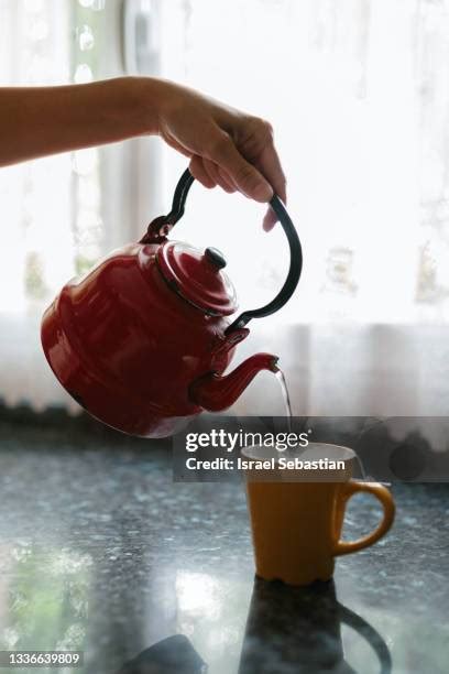 Woman Pouring Boiling Water Photos And Premium High Res Pictures