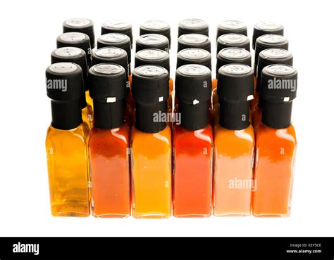 Set Of Hot Chili Sauce Glass Bottles On White Background Different Color Home Made Hot Sauce In