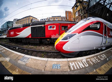 A New Lner Azuma Train Sits Alongside An Old Diesel Hst Train At London