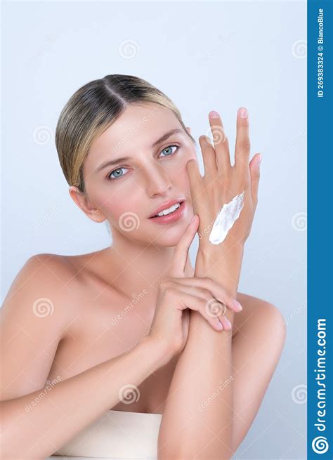 Alluring Beautiful Woman Applying Moisturizer Cream On Her Hand For