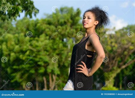 Portrait Of Happy Young Beautiful African Woman At The Park Stock Photo