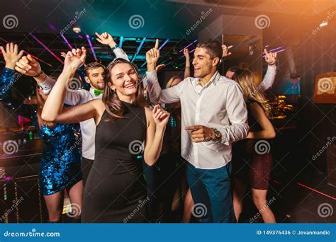 Happy People Are Dancing In Club Nightlife And Disco Concept Stock