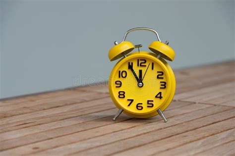 Retro Alarm Clock With Five Minutes To Twelve O Clock Stock Image