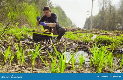 Scientist Ecologist in the Forest Taking Samples of Water Stock Image ...