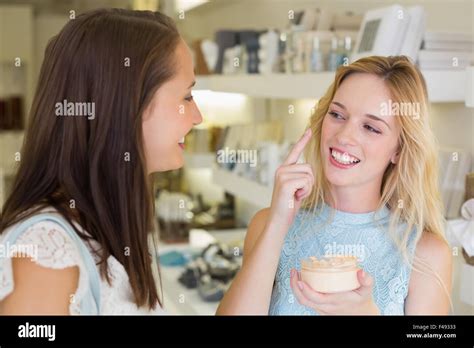 Smiling Blonde Woman Applying Cosmetic Hi Res Stock Photography And