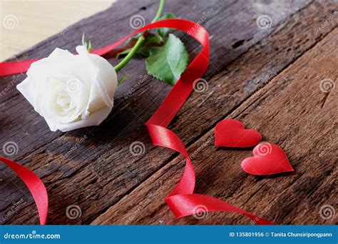 White Rose And Red Satin Hearts On Vintage Background For Valentines