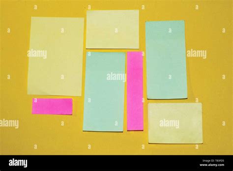 Sticky Notes With Different Size And Color On A Yellow Background