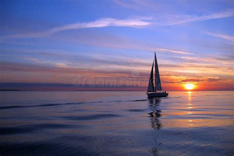 Yacht sailing at sunset stock image. Image of leisure, calm - 833813