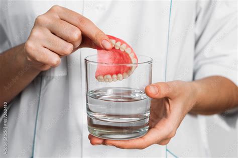 The Prosthesis Is In A Glass With A Solution Dental Prosthesis Care