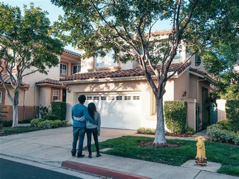 Couple Standing In Front of their House · Free Stock Photo