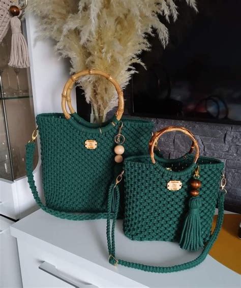 Two Green Purses Sitting On Top Of A Counter