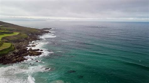 Tranquility Scene Of Ocean Waves Gently Splashing On Rocky Shore Of