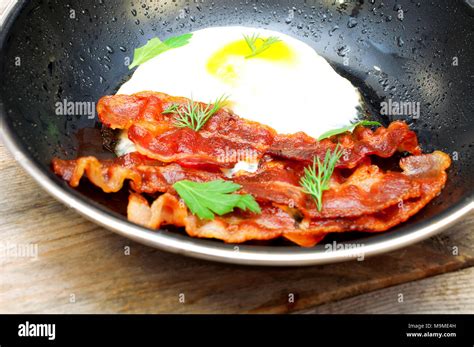 Bacon And Eggs In A Frying Pan Stock Photo Alamy