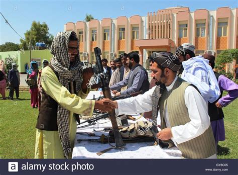 Helmand, Afghanistan. 17th Sep, 2016. A Taliban fighter shakes hands ...